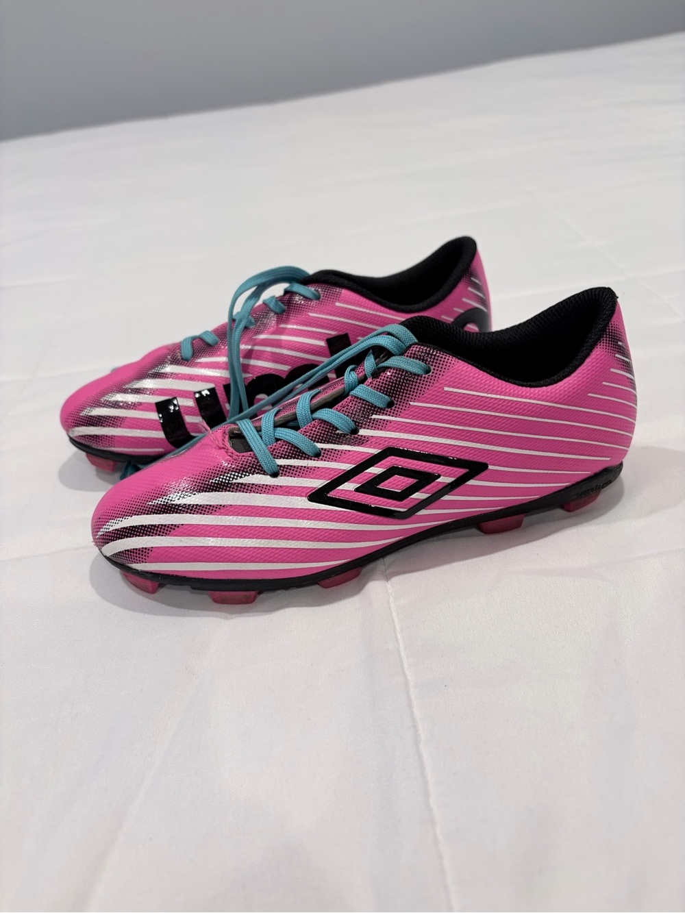 Umbro Arturo 2.0 FG Kids Pink Soccer Cleats with Teal Laces
